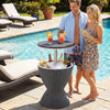 Outdoor rattan bar table with extendable tabletop, gray, serving drinks by the pool for parties and gatherings.