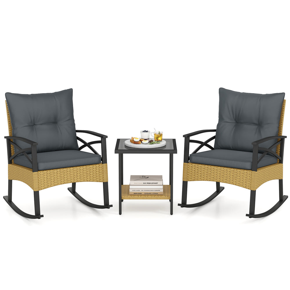 3-piece outdoor rattan rocking chairs set with gray cushions and a 2-tier side table for garden relaxation.