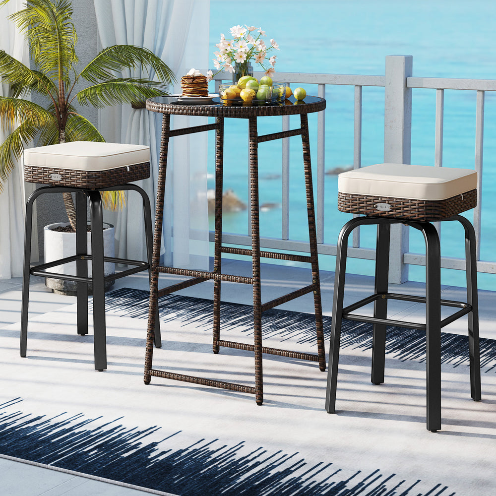 Outdoor swivel bar set featuring a PE rattan table and two cushioned chairs, perfect for patio or poolside use.