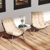 Cushioned papasan chairs in beige with a side table, perfect for outdoor patio lounging and relaxation.