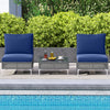 Navy blue cushioned conversation chairs with a tempered glass coffee table, perfect for garden or patio use.