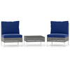 Two navy blue cushioned conversation chairs with a tempered glass coffee table, made of durable PE rattan for outdoor.