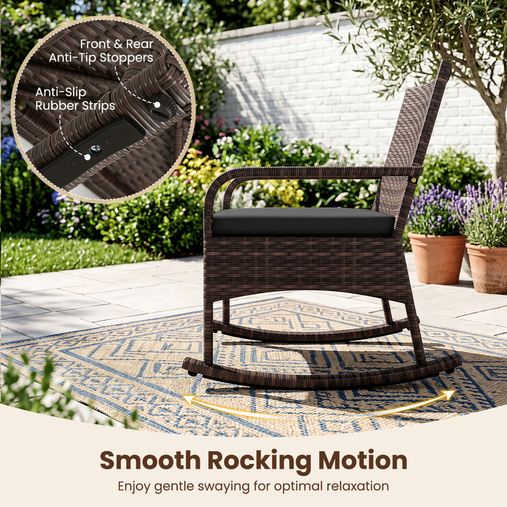 Black PE wicker rocking chair with ergonomic armrests and anti-slip rubber strips, perfect for porch relaxation.