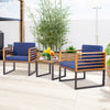 Acacia wood patio conversation set with navy cushioned armchairs and a coffee table, perfect for outdoor relaxation.
