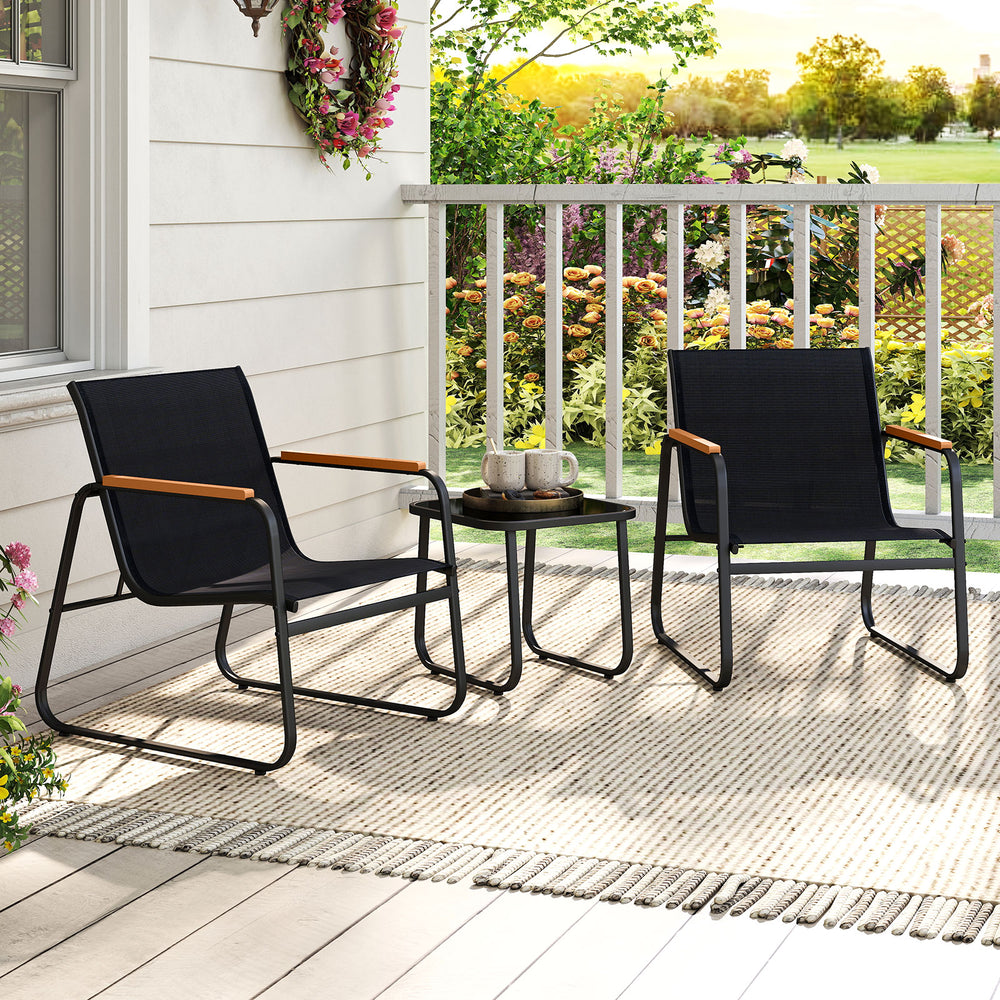 Two gray patio chairs with wood-plastic armrests and a square side table, perfect for outdoor conversation on a porch.
