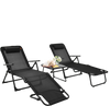 Two black folding patio chaise lounges with a faux marble table, perfect for outdoor relaxation and sunbathing.