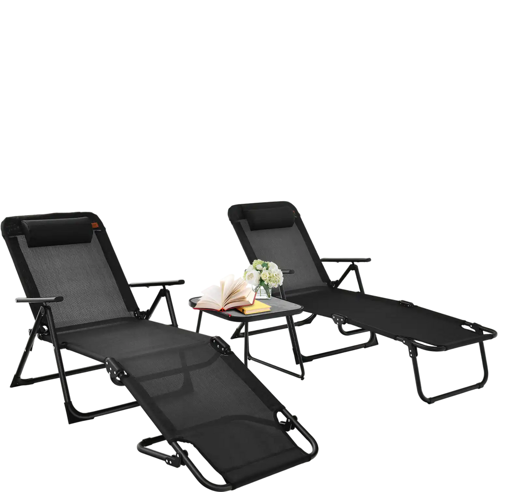 Two black folding patio chaise lounges with a faux marble table, perfect for outdoor relaxation and sunbathing.