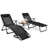 Two black folding patio chaise lounges with a faux marble accent table, perfect for outdoor relaxation and sunbathing.