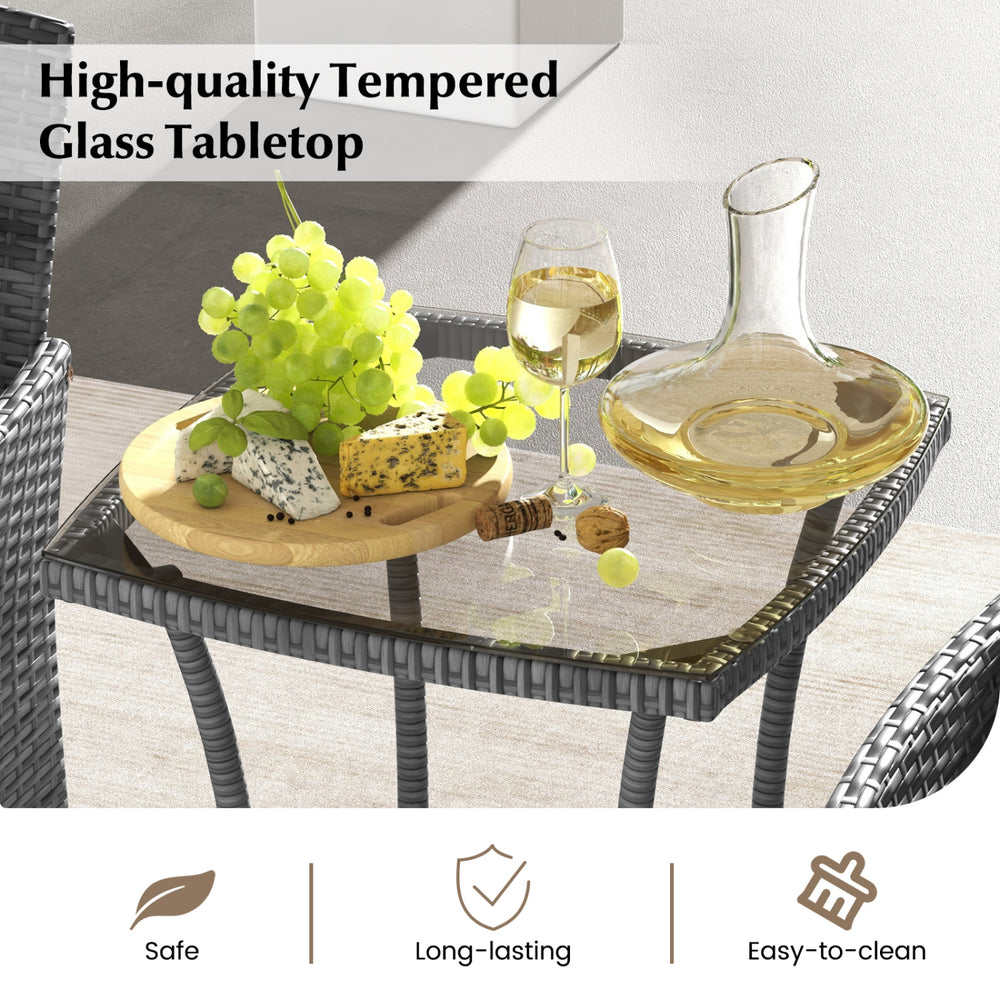 Tempered glass tabletop with a cheese platter and wine, part of a navy 3-piece patio furniture set for outdoor use.