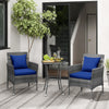 Cushioned patio chairs with navy covers and a tempered glass coffee table in a stylish outdoor setting.