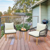 Cushioned patio chairs and tempered glass side table in black, perfect for outdoor relaxation on a balcony or porch.