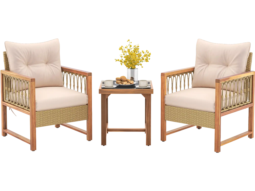 Two cushioned patio chairs with acacia wood frames and a small table, perfect for garden relaxation.
