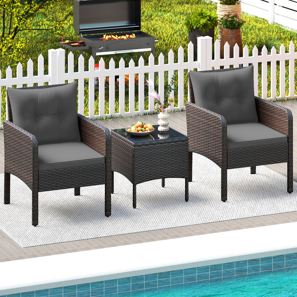 Two gray cushioned chairs with a square coffee table in a patio setting, made of hand-woven PE rattan for outdoor use.