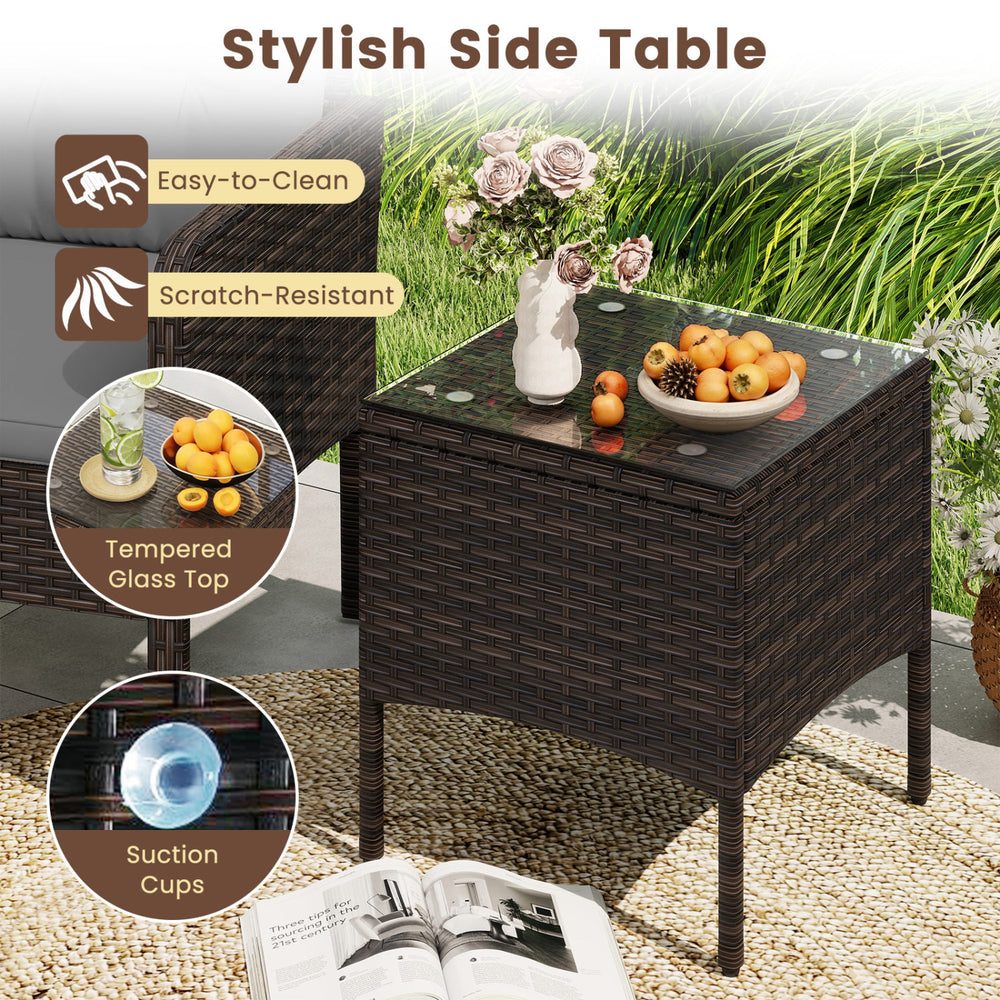 Stylish side table with tempered glass top and suction cups, made of PE rattan, perfect for patio or balcony use.