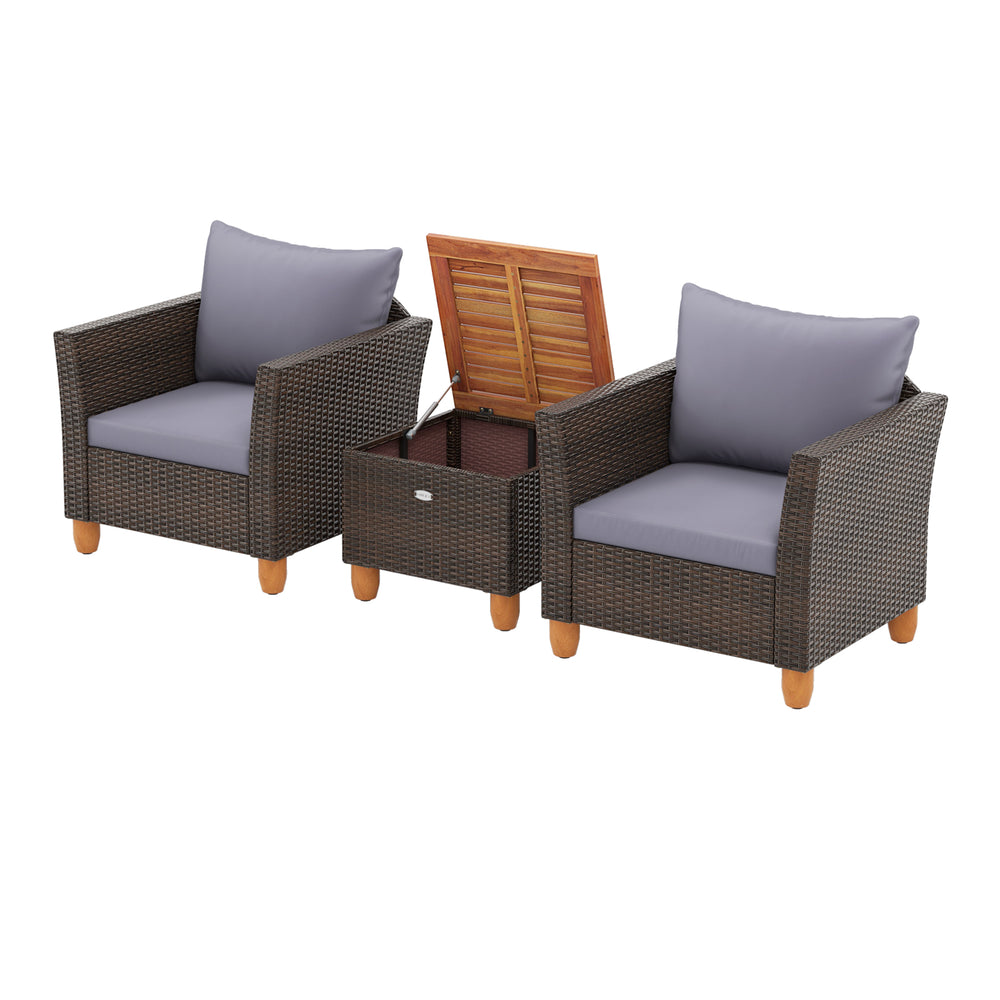 Two comfortable patio chairs with gray cushions and a wooden coffee table, made of PE rattan and acacia wood for.