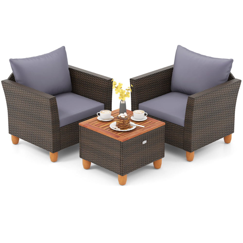 Two gray cushioned patio chairs with a wooden-top coffee table, perfect for outdoor relaxation in any setting.