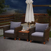 Two gray cushioned patio chairs with a wooden table, made of PE rattan, perfect for outdoor relaxation.