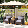 Two gray cushioned chairs and a wooden-top coffee table in a patio setting, perfect for outdoor relaxation.