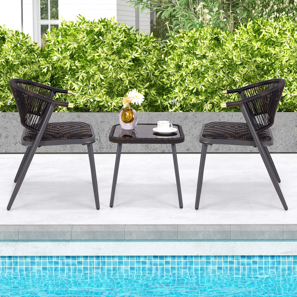 Two stylish brown and black patio chairs with a coffee table, perfect for backyard and poolside relaxation.