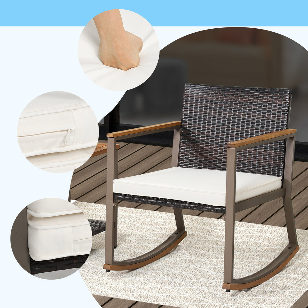 Rattan rocking chair with off-white cushion, featuring ergonomic design and sturdy metal frame for outdoor comfort.