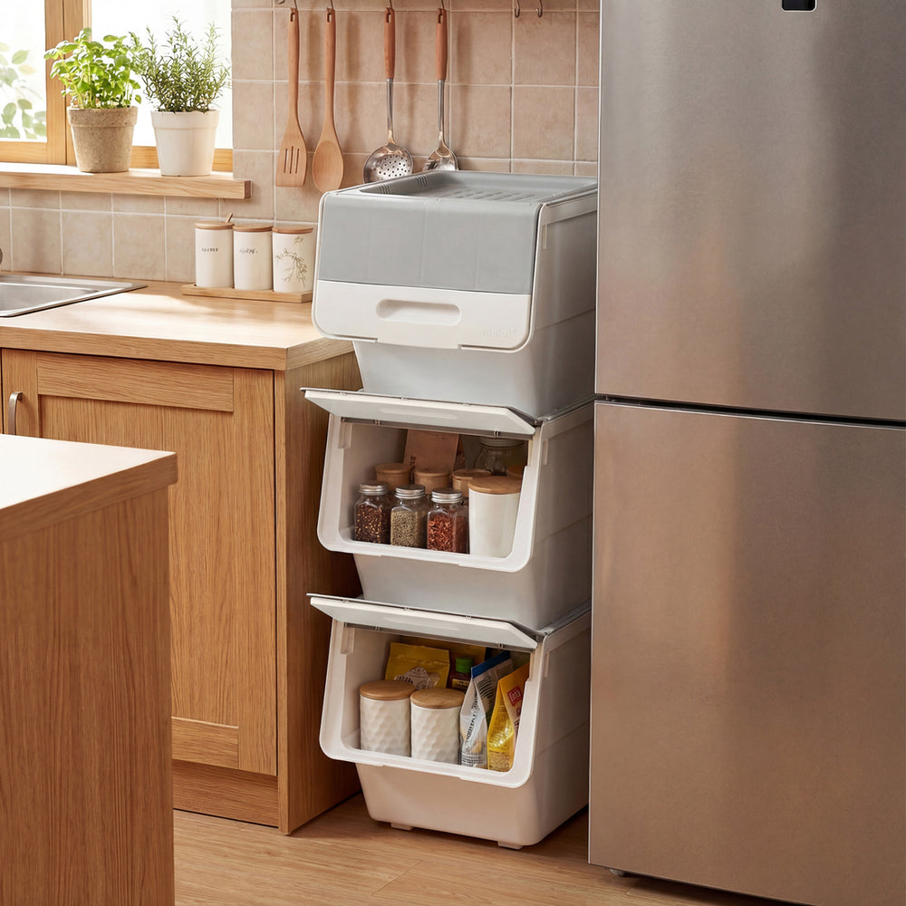 Stackable gray storage bins on wheels with stay-open lids, ideal for organizing kitchens and closets.