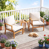Two acacia wood chairs with off-white cushions and a side table, perfect for patio or balcony relaxation.
