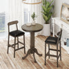 Round wood bar table set with pedestal base and two armless stools, perfect for intimate meals in a farmhouse style.