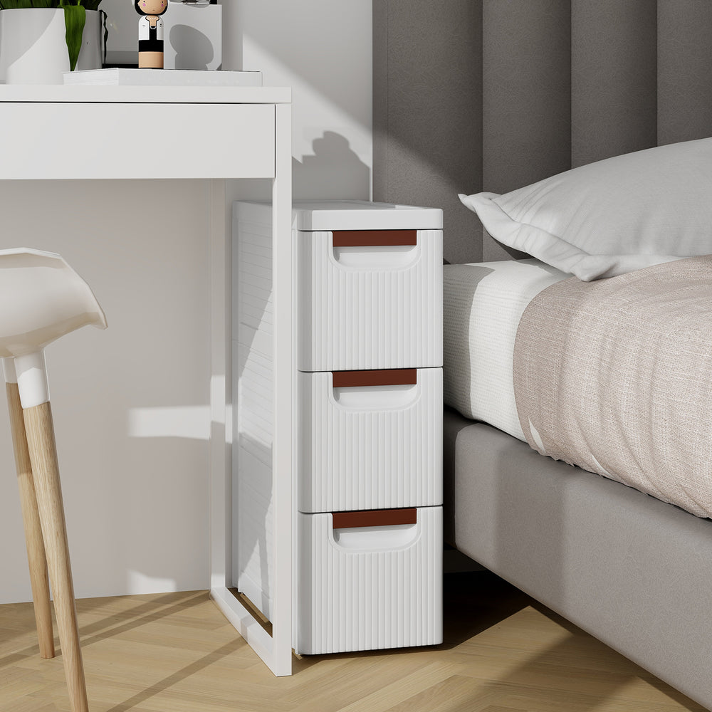 Narrow 3-drawer rolling organizer unit in white with fluted surface, ideal for small spaces and easy access.