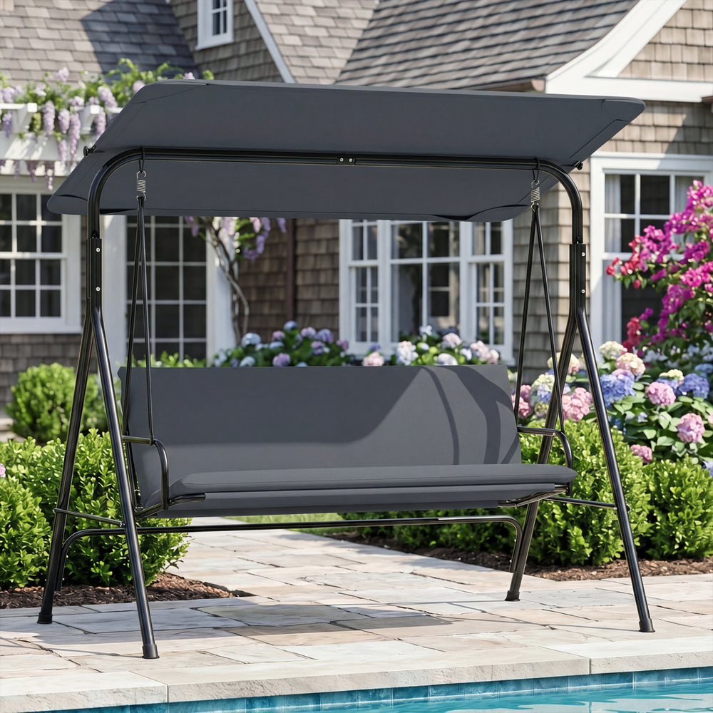 3-seat patio swing chair with adjustable canopy and removable gray cushions, perfect for outdoor lounging by the pool.