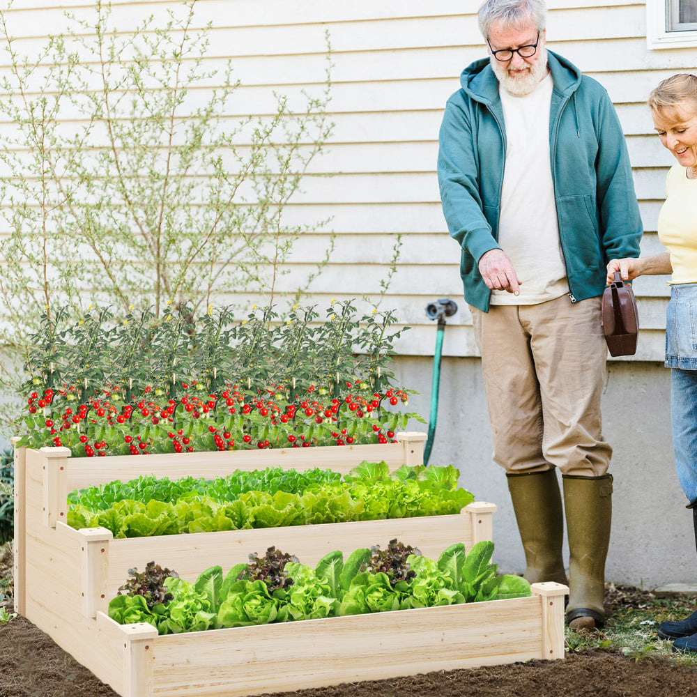 Three-tier elevated wooden vegetable garden bed made of sturdy fir wood, ideal for growing various plants outdoors.