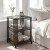 3-tier rolling side table with open storage shelves, black metal design, perfect for bedside or living room use.
