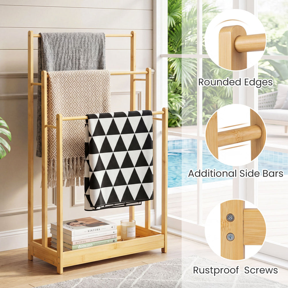 Three-tier free-standing bamboo towel rack with storage shelf, featuring ample hanging space and a waterproof surface.