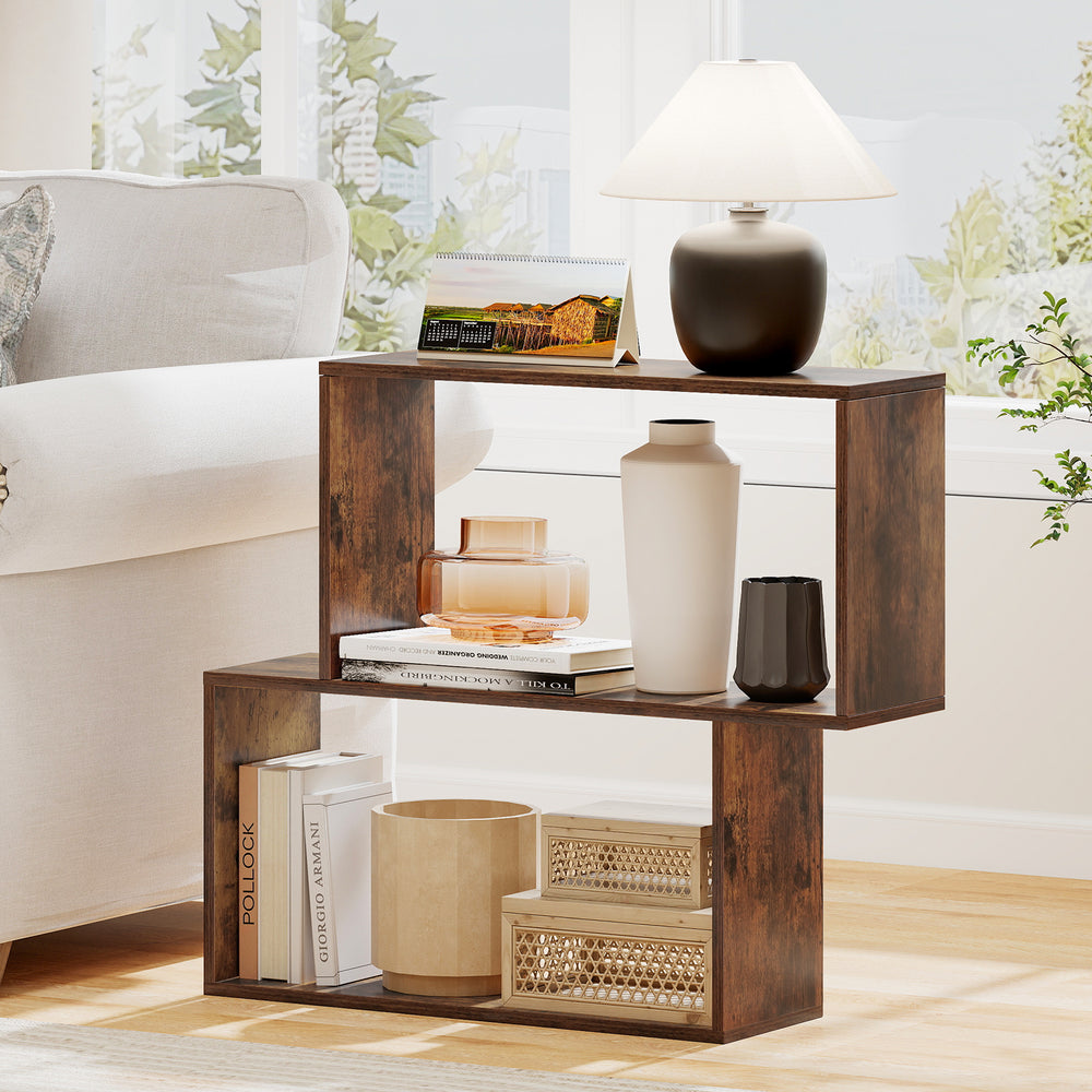 Freestanding 3-tier geometric bookshelf in brown, featuring open shelves and two cubic compartments for versatile.