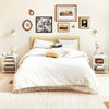 Modern white nightstand with three open shelves, perfect for compact spaces and easy access in a bedroom setting.