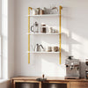 Three-tier modern wall-mounted shelving unit with white shelves and gold metal ladder, ideal for kitchen or coffee.