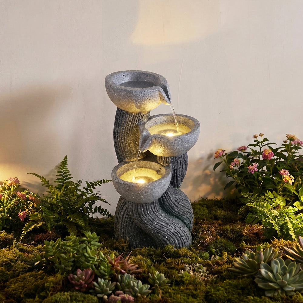 3-tier outdoor water fountain with LED lights, resin construction, and cascading design for patio or deck decoration.