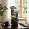 Three-tier outdoor water fountain with LED lights, resin construction, and cascading design for relaxing ambiance.