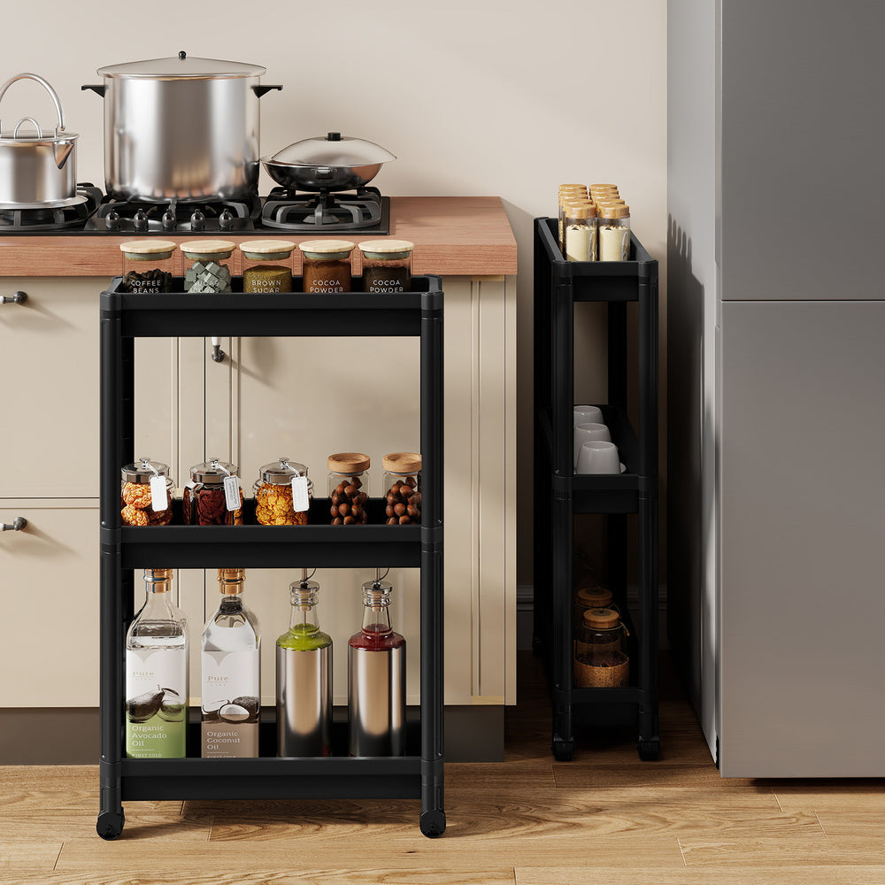 3-tier slim rolling storage cart in black, featuring waterproof material and wheels, ideal for kitchen or bathroom.