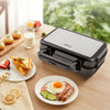 3-in-1 sandwich maker with removable non-stick plates, featuring grilling and waffle options for versatile cooking.