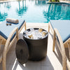 Black 3-in-1 outdoor umbrella base with water bag, designed for stability and easy organization in patio setups.