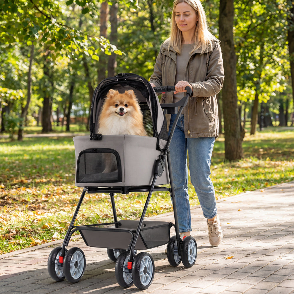 Pet stroller with removable carrier in gray, featuring a cozy interior and 180° canopy for outdoor adventures.