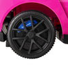 Close-up of the black tire on the pink Maserati licensed 3-in-1 ride-on push car, featuring durable design for kids.