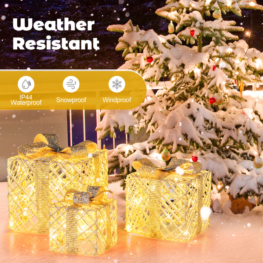 Three illuminated Christmas gift boxes with 50 LED lights, made of weatherproof material for indoor and outdoor decor.