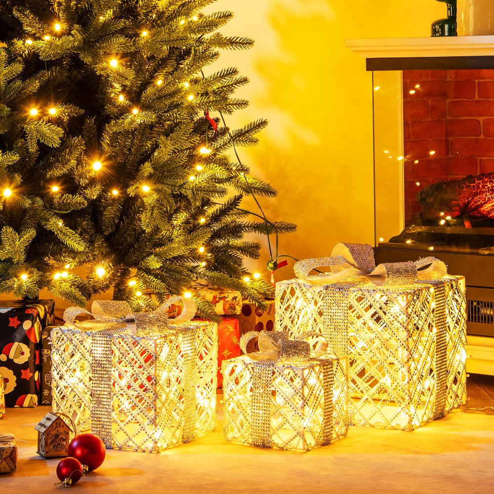 Three lighted Christmas gift boxes with 50 LED lights, featuring detachable bows, perfect for indoor or outdoor.