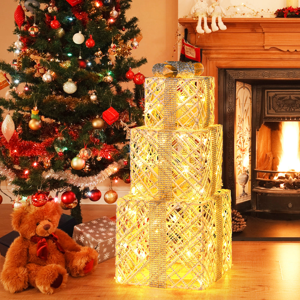 Three lighted Christmas gift boxes with 50 LED lights, featuring detachable bows, perfect for festive indoor and.
