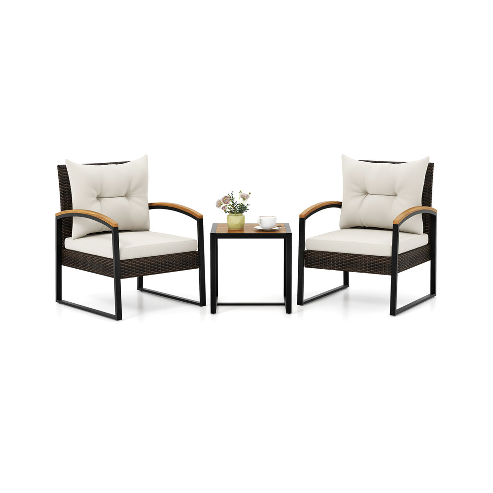 Two cushioned patio chairs with acacia wood armrests and a square table, perfect for backyard relaxation.