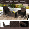 3-piece patio rattan chair set with cushioned seats and glass tabletop, perfect for outdoor relaxation and conversation.