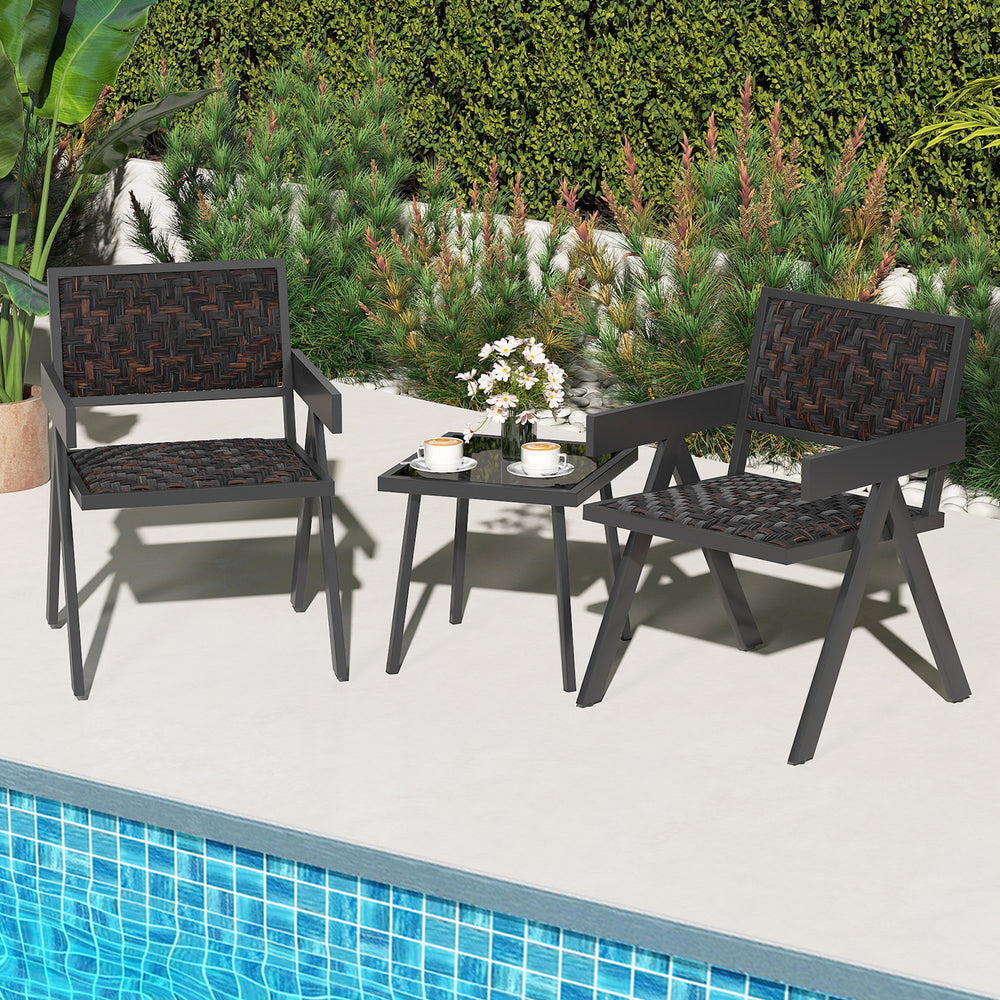 Two black patio chairs with quick-drying foam and a glass table, perfect for outdoor relaxation by the pool.