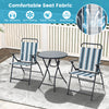 Two striped folding chairs and a round table in a patio setting, featuring breathable fabric and a heavy-duty metal.