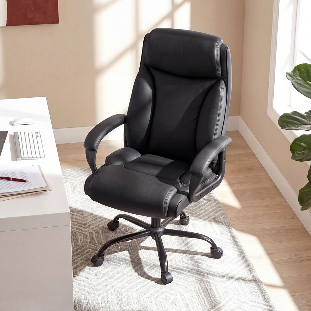 High back leather office chair designed for big and tall users, featuring adjustable height and smooth-rolling wheels for mobility.